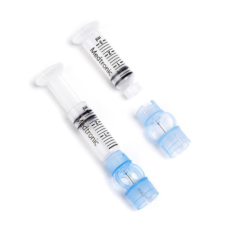 Medtronic Paradigm 3 milliliter Reservoir MMT-332A. Device is a white and blue plastic syringe.